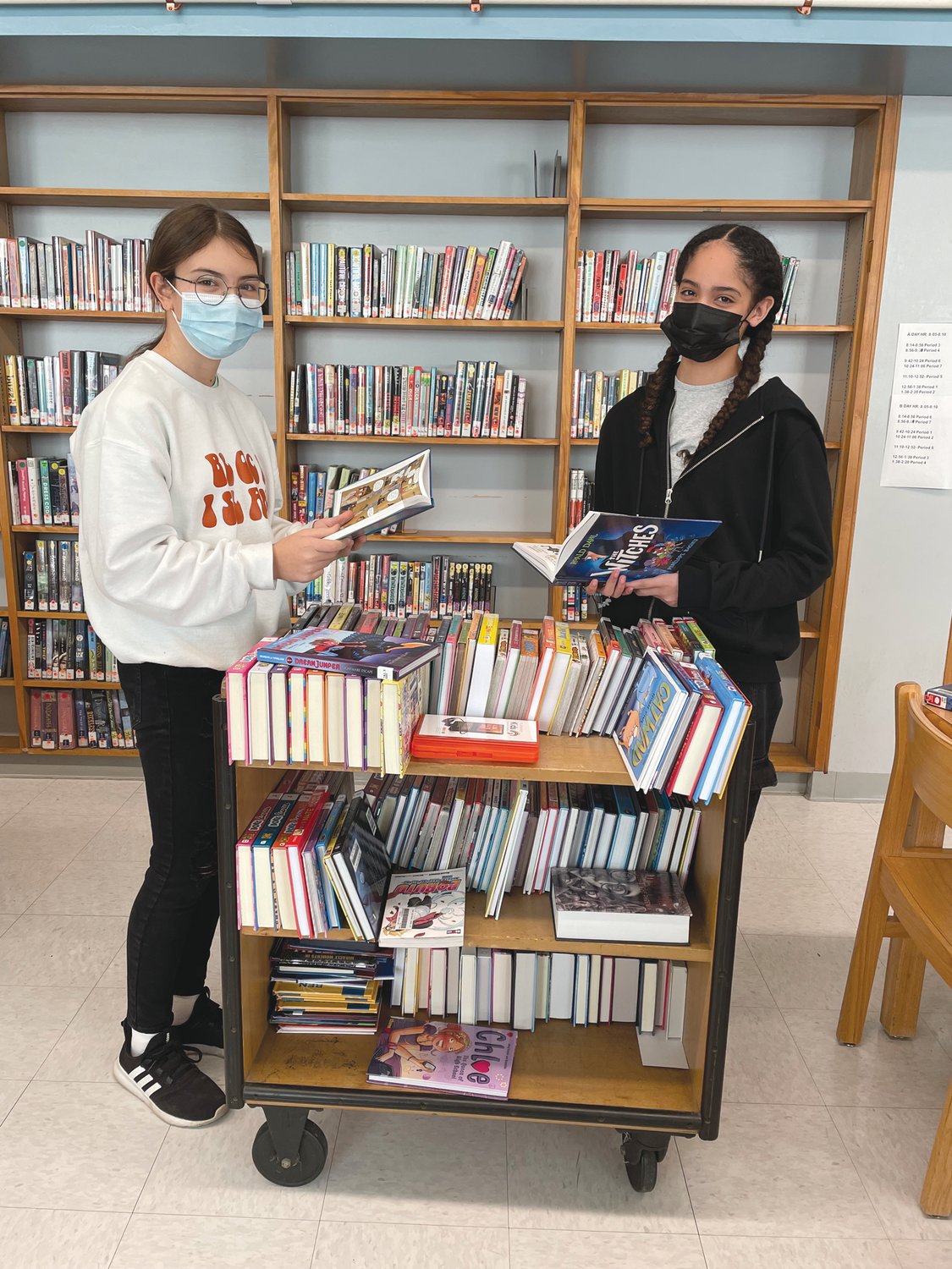 NEW BOOKS: Park View Middle School was recently awarded a $7,500 grant from The Office of Library and Information Services to purchase new materials at the library. The funds came from the American Rescue Plan Act. Pictured left to right is Sophia DeLuca and Merelie Ramos.